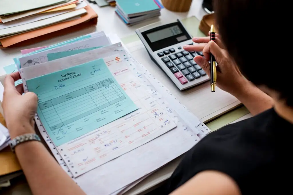 a woman doing a business bank account reconciliation